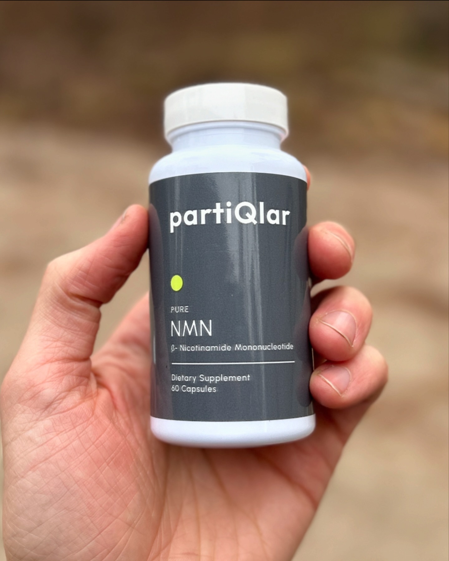 Customer holding Pure NMN outdoors